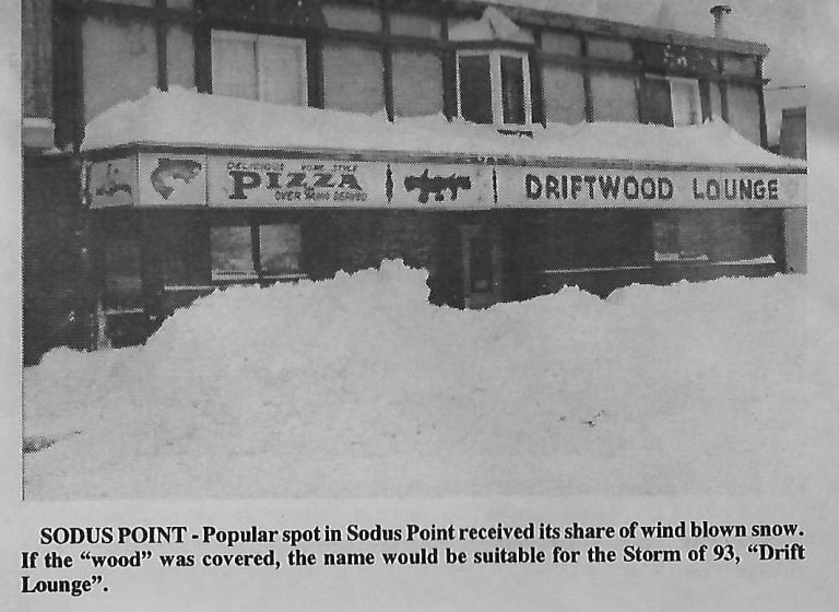 Newspaper photo of the Driftwood Lounge and its pizza sign half buried in snowdrifts after the Storm of '93